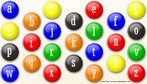 Imagem de vrios pequenos crculos de vrias cores (semelhantes a chocolates MM), cada um com uma letra.  Palavras-chave: crculo, cor, alfabeto, letra, chocolate, interdiscurso, publicidade.