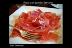 Imagem de um prato com Jamn Serrano. Este presunto tpico espanhol  curado nos ambientes montanhosos, onde os invernos secos, muito frios, a umidade baixa e uma abundncia de ar fresco so uma caracterstica proeminente. Essas circunstncias so essenciais para produzir um verdadeiro presunto Serrano. Palavras-chave: Jamn. Presunto. Comida. Campo lxico. Campo semntico.